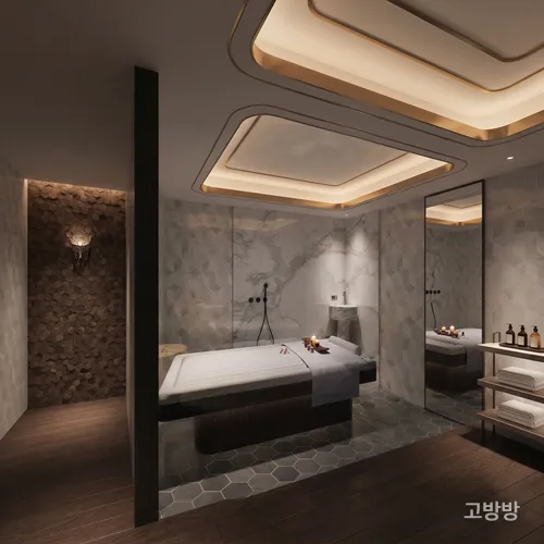 골드 간접조명 천장 아래 마사지 베드와 대형 거울이 있는 엠파이어 사우나 테라피룸, 마카오